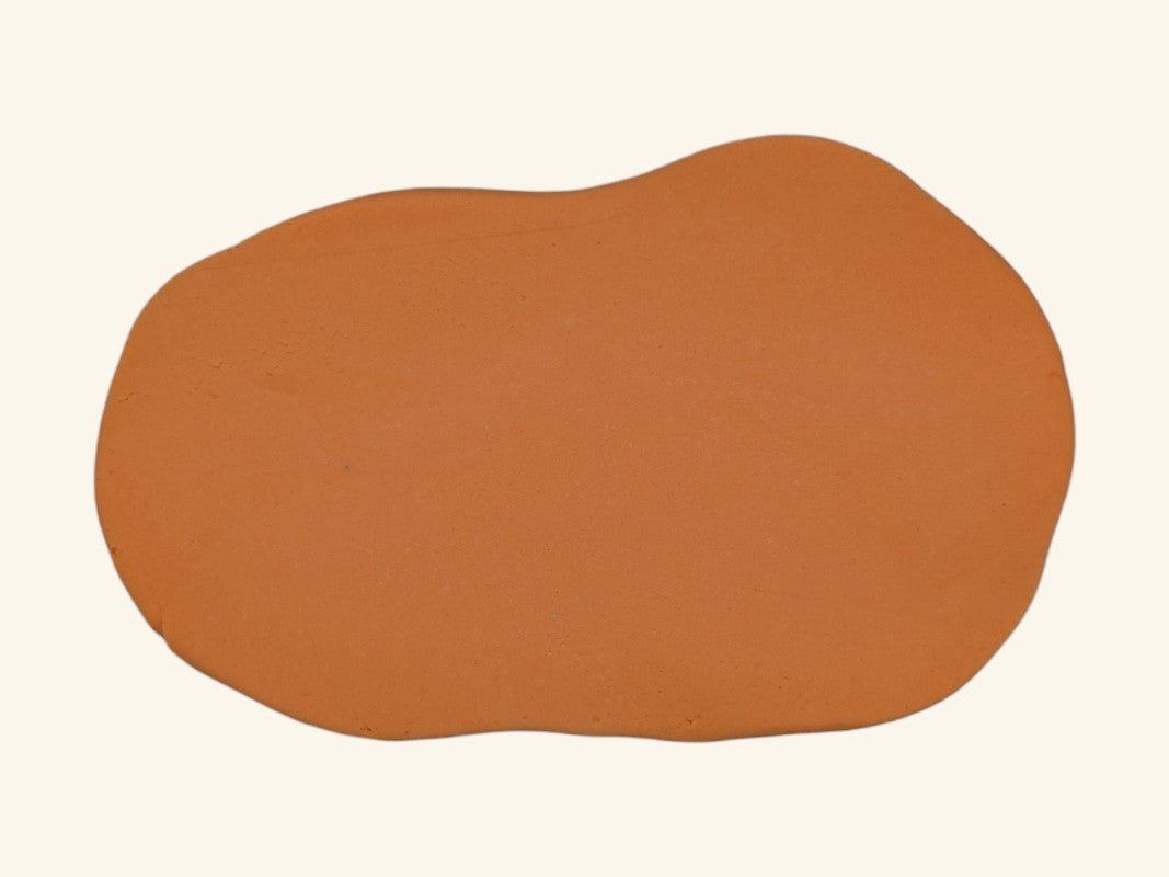 plastilina portocalie intinsa pentru joaca buna cu roller pentru forme